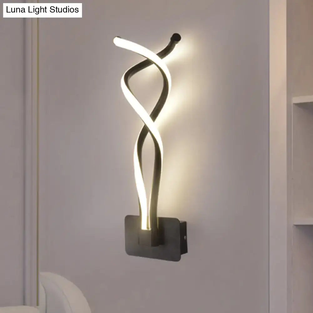 Modern black wall lamp with a sleek twisted led light design and white acrylic shade featuring a musical note motif