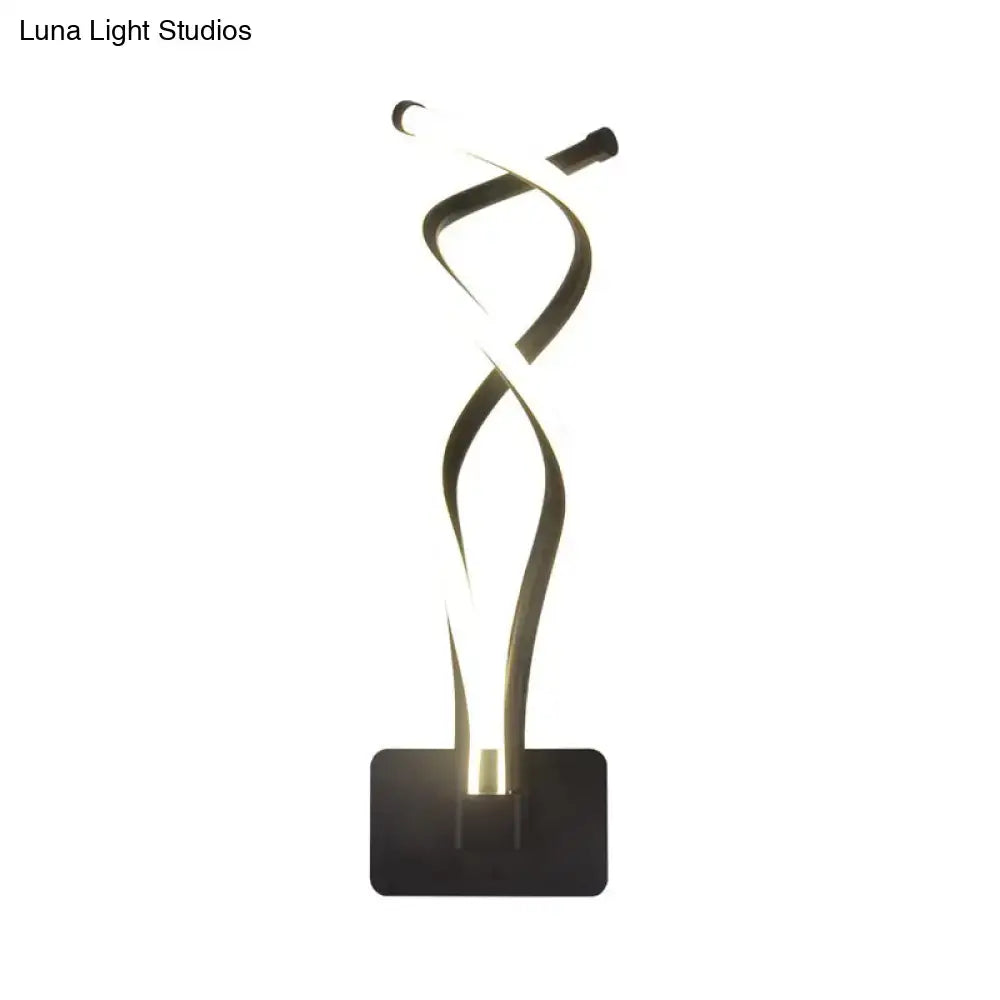Modern black and white wall lamp with a sleek twisted led design and acrylic musical note shade for bedroom use