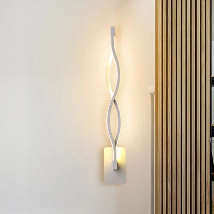 Modern white led wall lamp with sleek twisted design and warm ambient lighting featuring acrylic shade and musical note motif