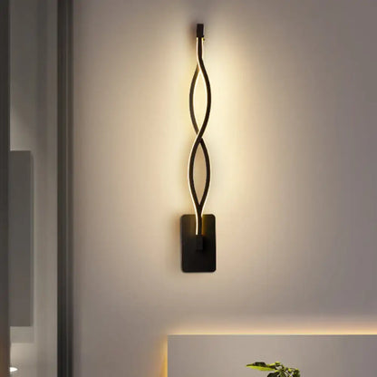 Modern black and white musical note wall lamp with acrylic shade and sleek twisted wall sconce design with warm led lighting