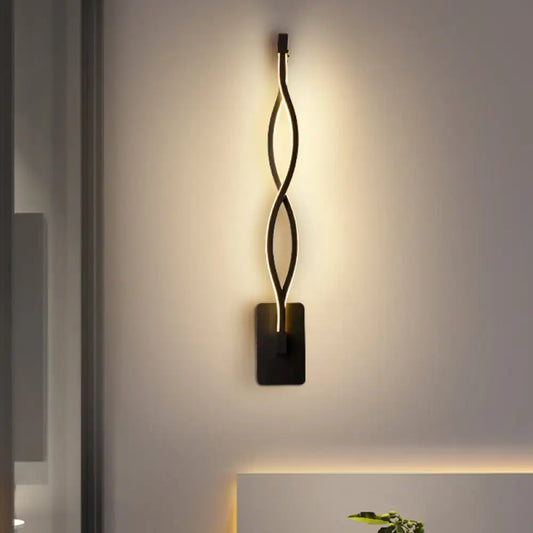 Modern black and white musical note wall lamp with acrylic shade and sleek twisted wall sconce design with warm led lighting