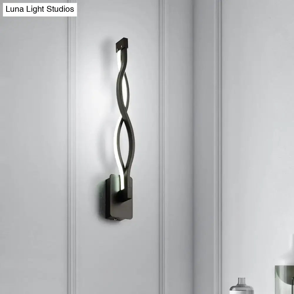 Modern black twisted led wall lamp with white acrylic musical note shade in a sleek minimalist bedroom design