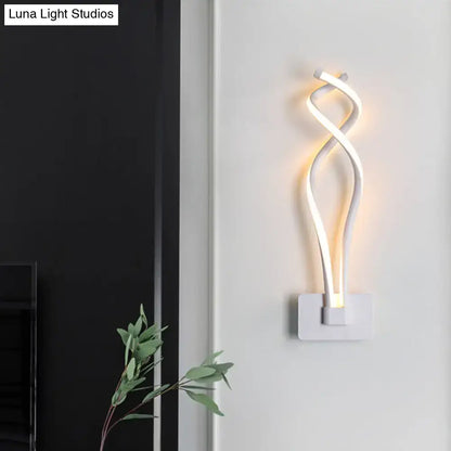 Modern black and white wall lamp with a sleek twisted design and acrylic shade featuring a musical note motif