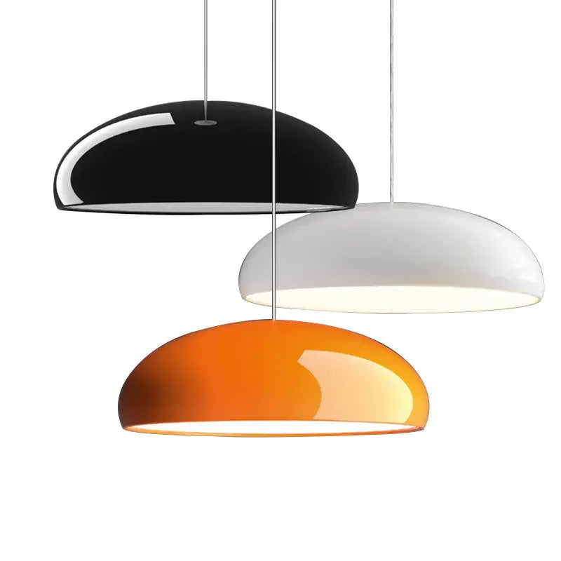 Three modern dome-shaped decorbites led pendant lights in glossy black white and orange for luxury nordic interiors
