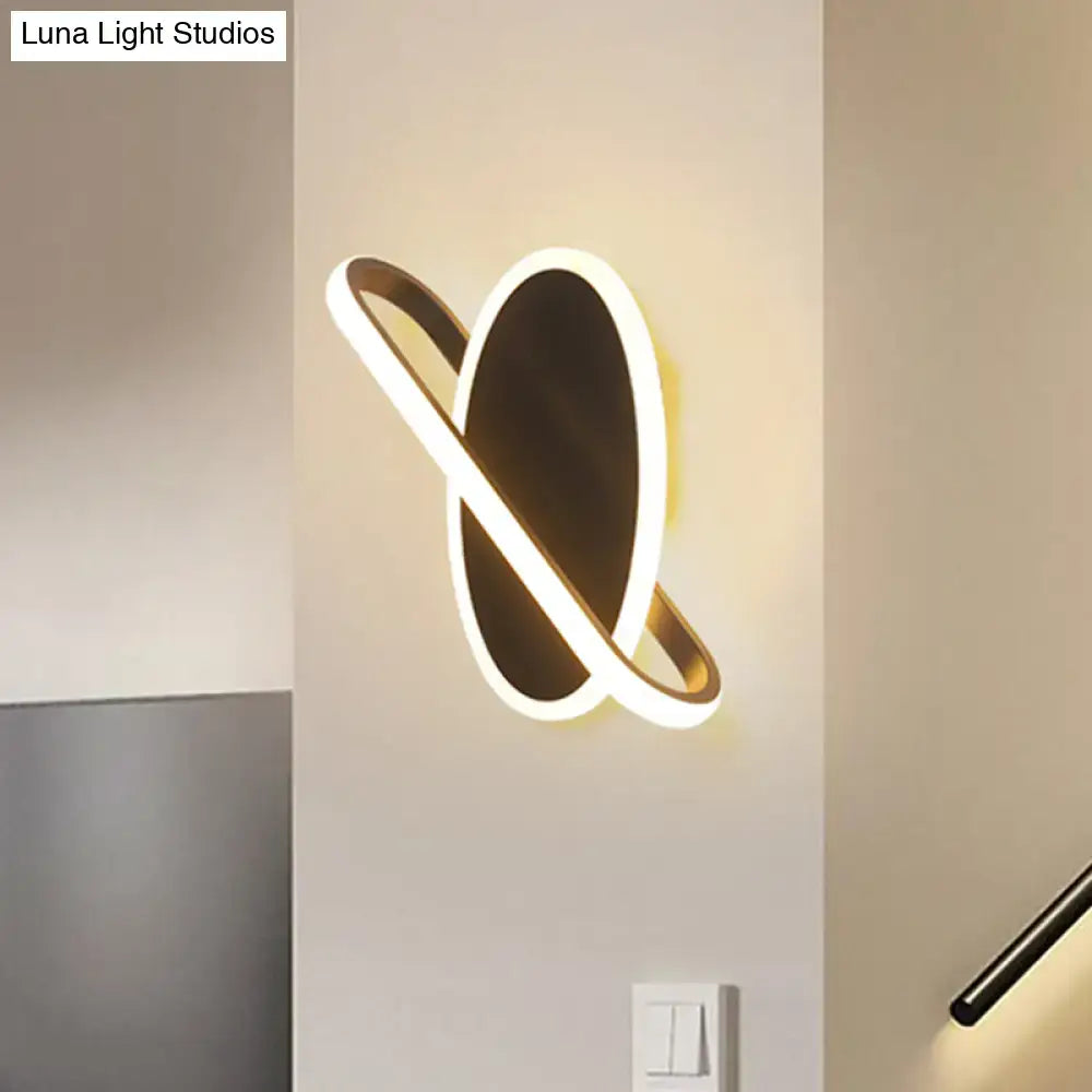 Modern black and white oval led sconce stairway light with warm glow featuring a dark metallic base and white warm led ring