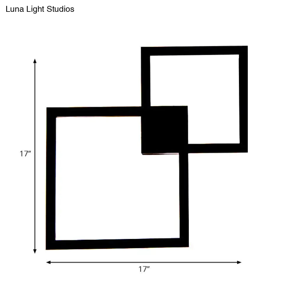 Modern black wall sconce with two overlapping 17 inch acrylic shade squares for dining room decor
