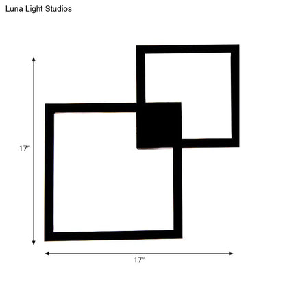 Modern black wall sconce with two overlapping 17 inch acrylic shade squares for dining room decor