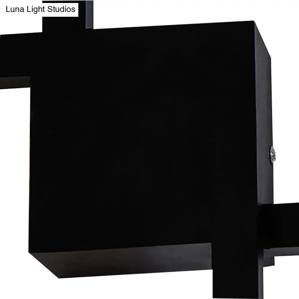 Modern black wall sconce with geometric matte finish and acrylic shade for dining room lighting