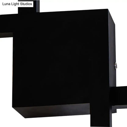 Modern black wall sconce with geometric matte finish and acrylic shade for dining room lighting