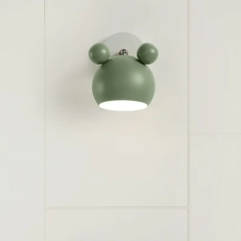 Modern black and white panda led wall lamp with olive green spherical design, rounded ears, and metallic accent for bathroom mirror light