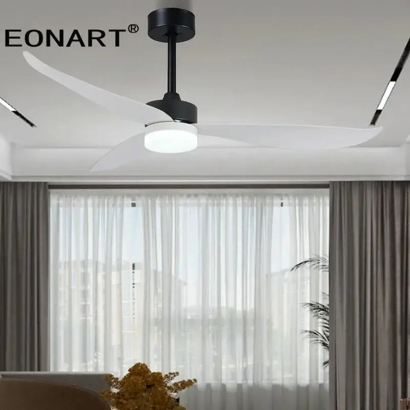 Modern black and white plastic blade ceiling fan with three blades, central light, and remote control for bedroom use