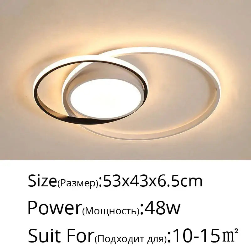 Modern black and white rectangular led ceiling light with interlocking rings emits warm glow decorbites led ceiling light