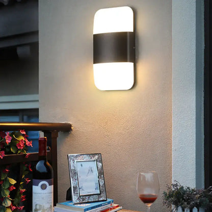 Modern black and white rectangular sconce light emitting warm white ambient light compatible with 220v-240v and 110v-120v