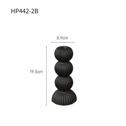 Modern black ribbed geometric ceramic candle holder with four stacked spherical tiers for stylish decorbites decor
