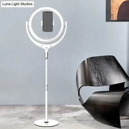 Modern black and white led mirror lamp featuring a white ring light with adjustable stand and phone holder for bedroom use
