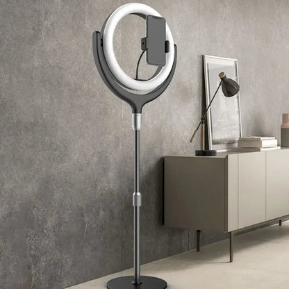 A sleek modern black and silver led mirror lamp with ring led mirror and phone stand for bedroom use
