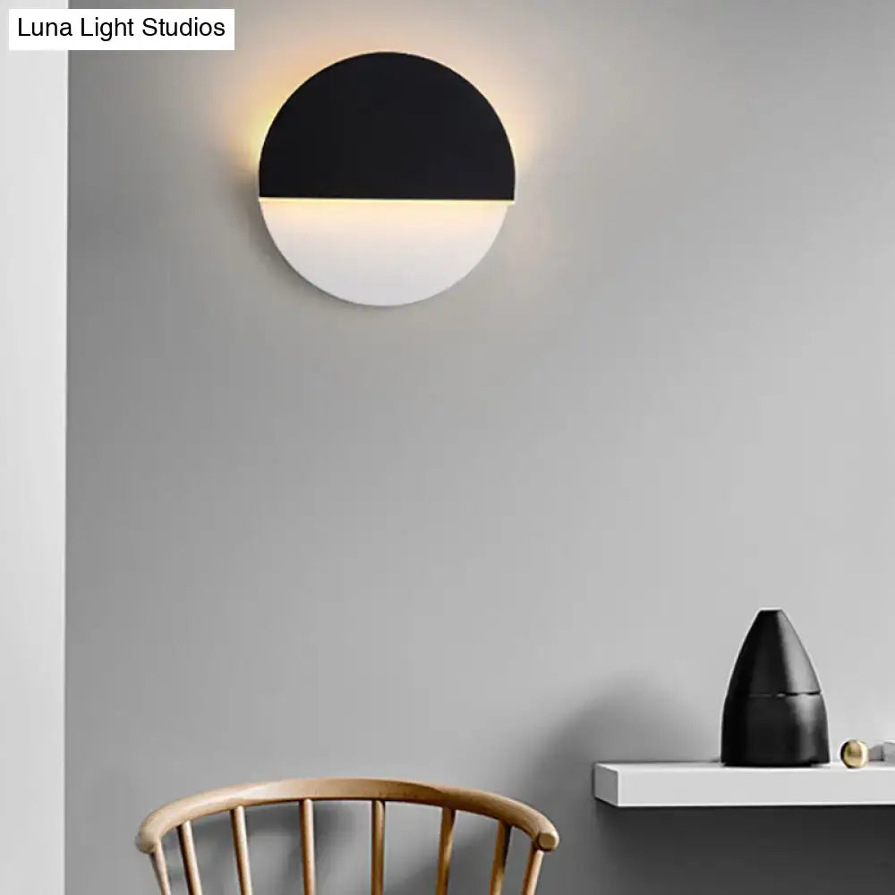 Modern black and white rotatable acrylic wall lamp with sleek minimalist half-moon design for bedroom use