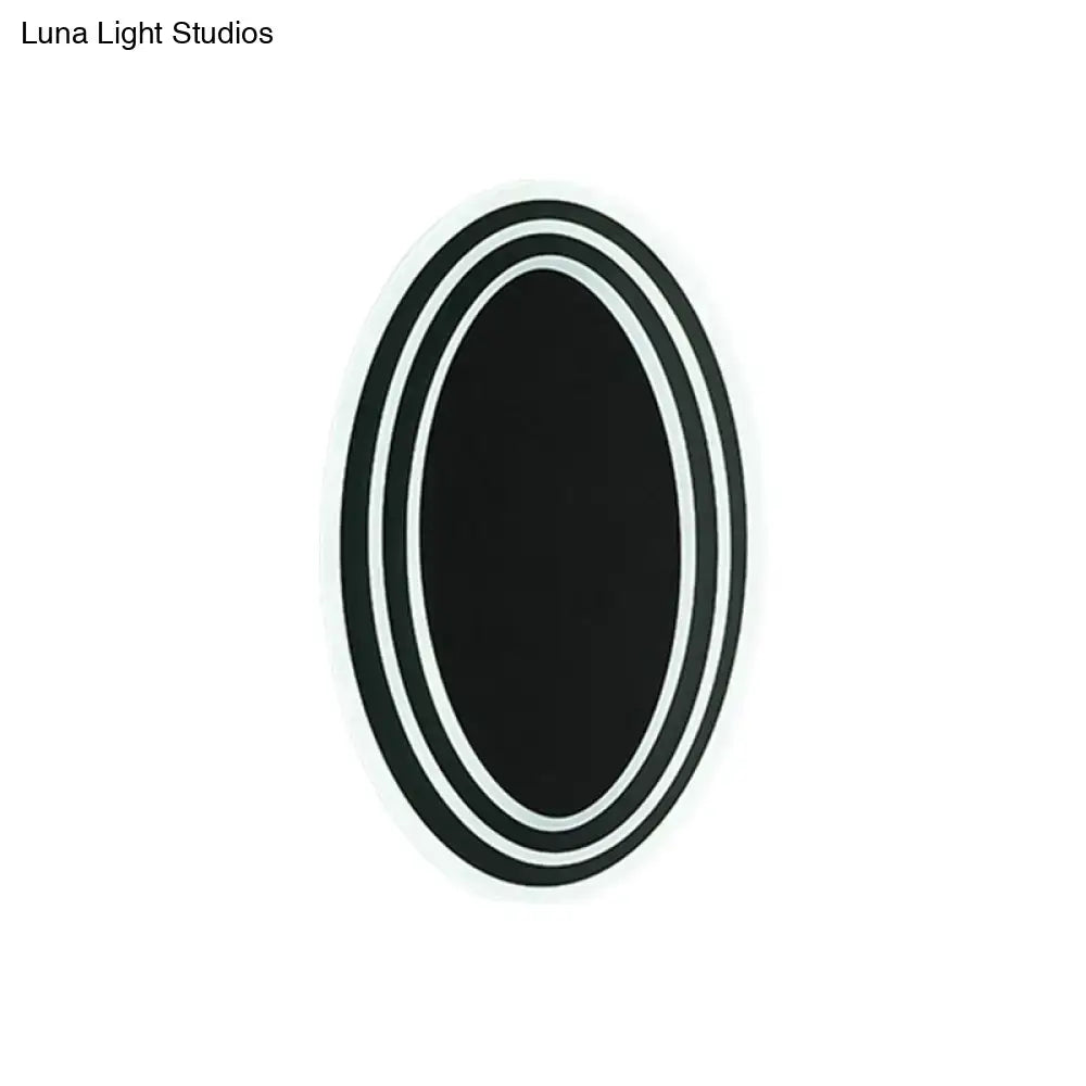 Modern black and white rotatable led wall light fixture with black oval sticker and three concentric white borders