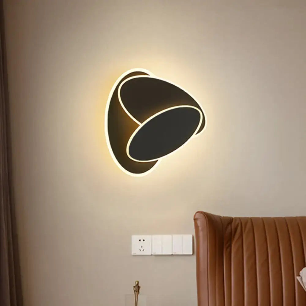 Modern black and white rotatable led wall light fixture with sleek oval design and glowing white light trim for bedroom mirror
