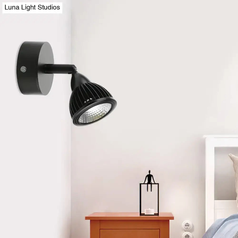 Modern black and white rotatable wall light with ribbed lamp head and sleek metallic finish for bedroom spotlight use