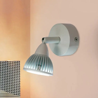Modern black and white wall light with rotatable spotlight, sleek metallic arm, and ribbed frosted glass shade for bedroom use
