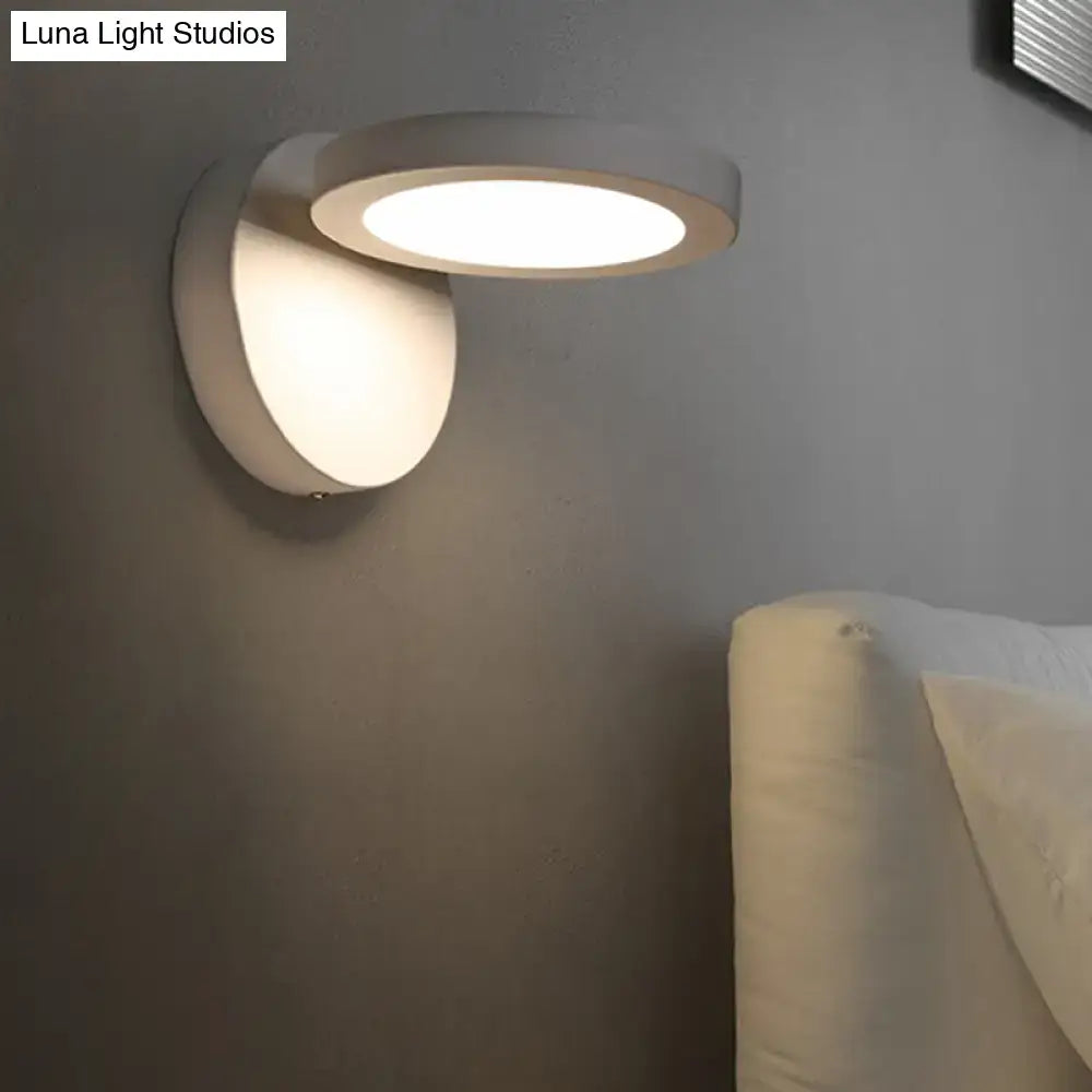 Modern white circular wall light fixture with sleek minimalist design in black and white for bedroom glow lighting