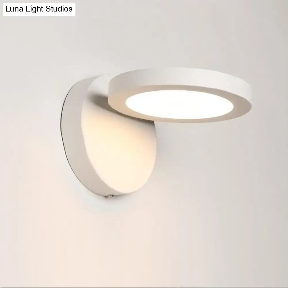 Modern white circular wall light fixture with sleek minimalist design for bedroom glow in black and white rotating style