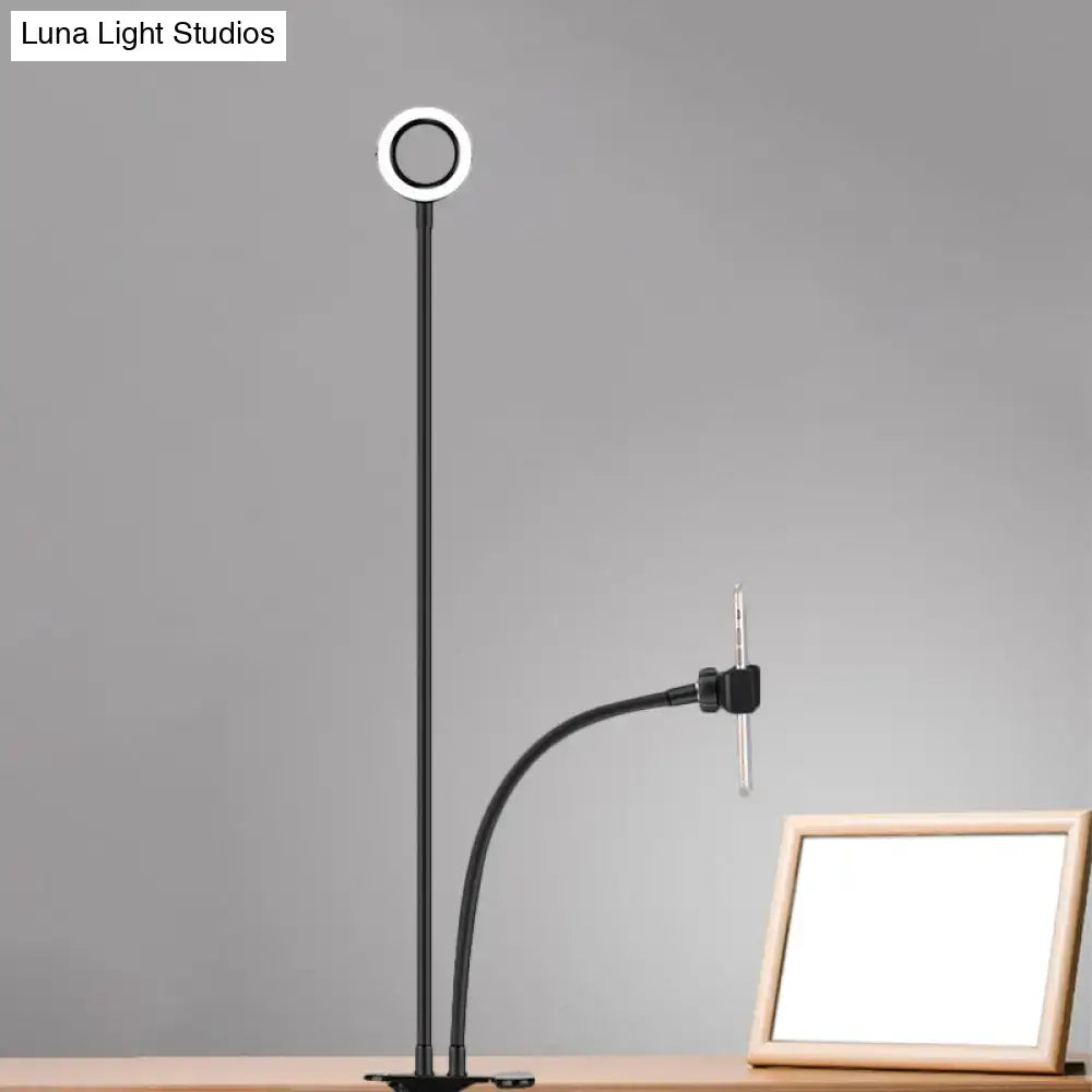 Modern black and white round usb mirror lamp featuring a metal round usb ring light with adjustable arm and clamp for desk use