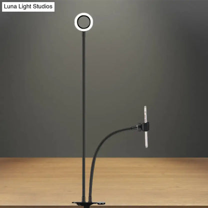 Modern black and white metal round usb mirror lamp with flexible arm and phone clamp for photography use