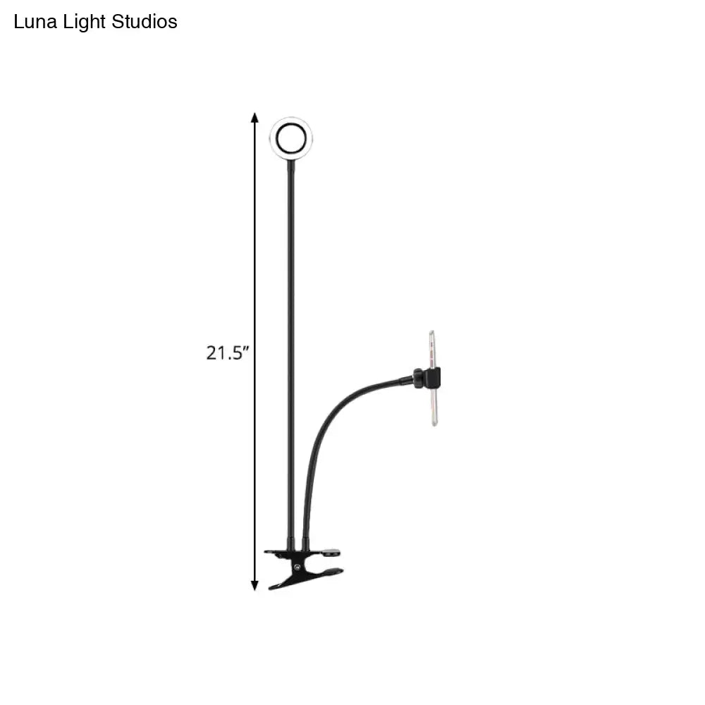 Black adjustable metal round usb desk lamp with ring light and flexible arm featuring phone clamp for bedroom use