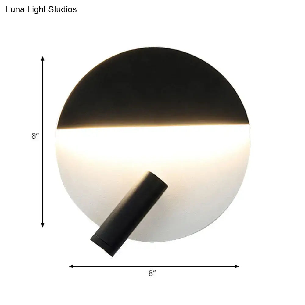 Modern black and white round wall lamp with an 8-inch circular LED wall light emitting soft ambient light for bedroom use