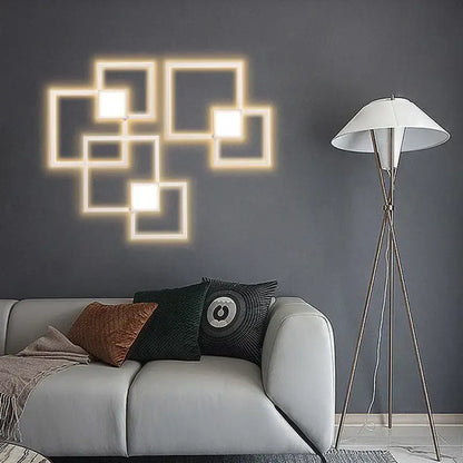 Modern black and white geometric led wall sconce with glowing interlocking square panels for bedroom lighting