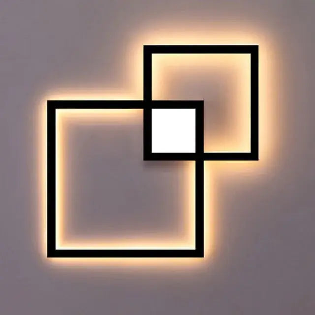 Modern black and white square led wall sconce with geometric frame and warm led lighting for bedroom use