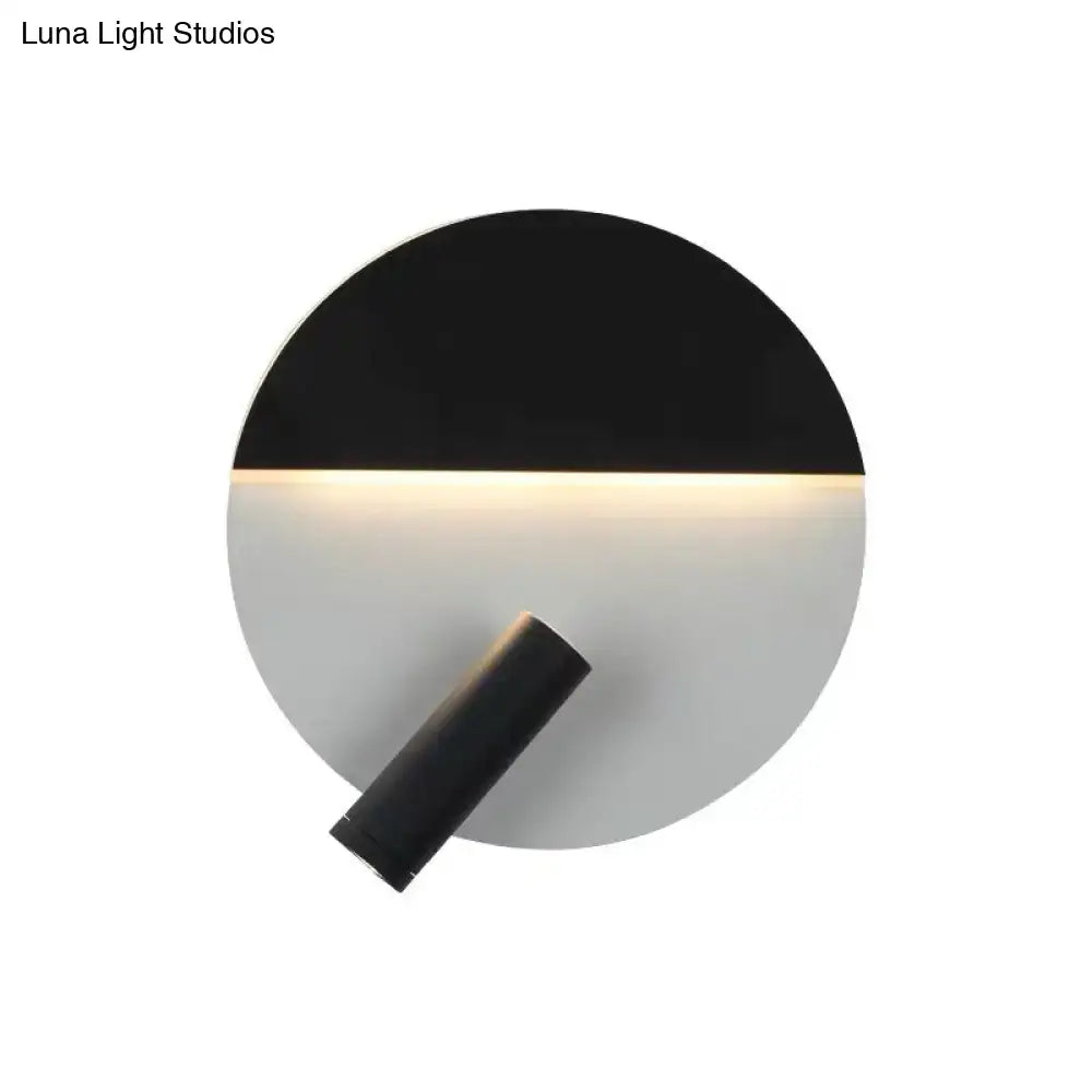 Modern black and white wall sconce with adjustable spotlight featuring a sleek minimalist design for bedroom lighting