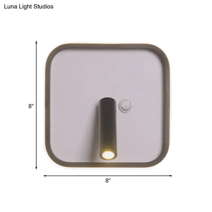 Modern black and white wall light with matte bronze frame and cylindrical led bulb emitting white warm light for bedroom use