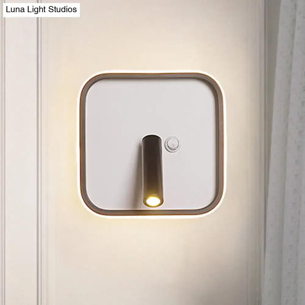 Modern black and white warm light wall light with white warm light, brushed bronze frame, and cylindrical led fixture