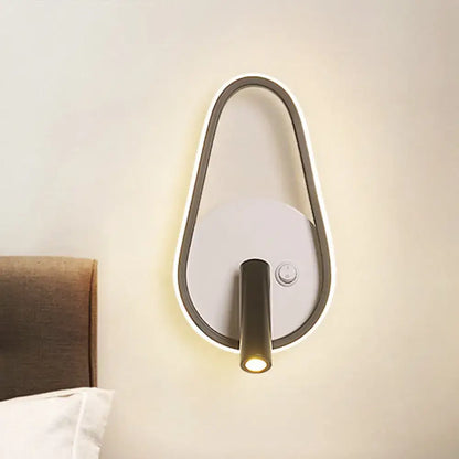 Modern black and white warm light wall light with teardrop matte black frame and glowing led backlighting for bedroom use