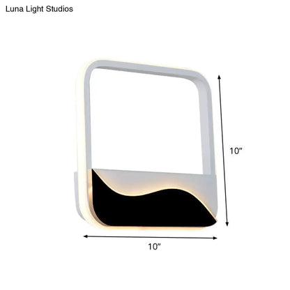 Modern black and white wave led wall light with sleek white frame and black accent panel emitting warm ambient light wall lamp