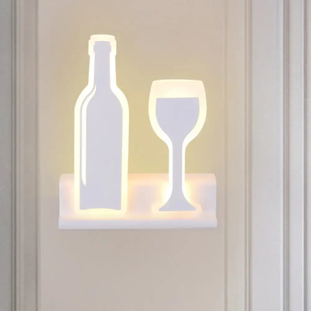 Modern black white chrome sconce light shaped like a wine bottle and glass fixture height ideal for dining room decor