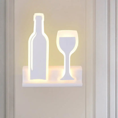 Modern black white chrome sconce light shaped like a wine bottle and glass fixture height ideal for dining room decor