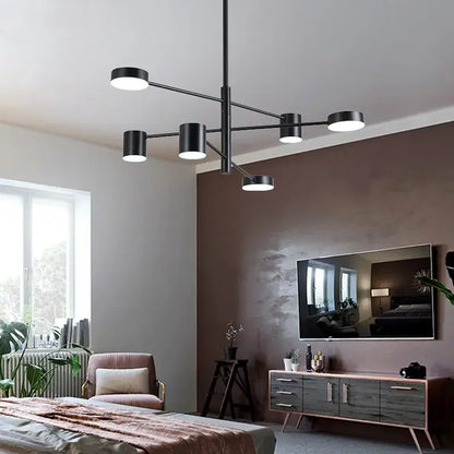 Modern black wrought iron chandelier with six cylindrical lights suspended from a central rod for living room lighting