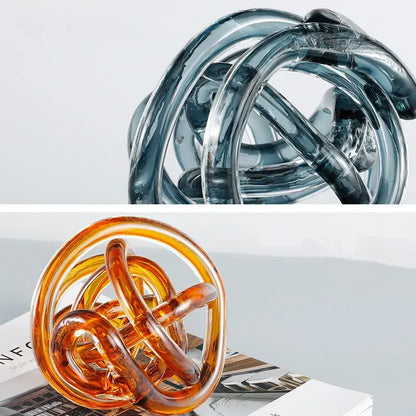 Modern blue amber and gray glass coil ball decorative figurine featuring translucent interlocking curved rings for living room decor
