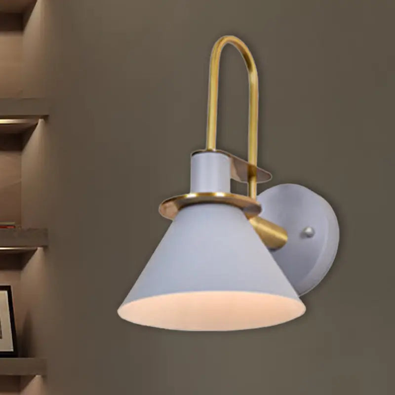 A modern wall-mounted lamp with a matte white conical shade and brass accents for e26 e27 bulbs