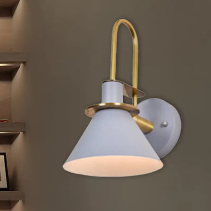 A modern wall-mounted lamp with a matte white conical shade and brass accents for e26 e27 bulbs