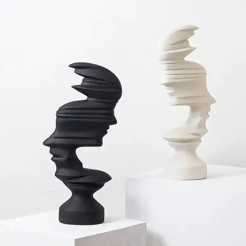 Modern blue ceramic abstract human face sculpture featuring black and white layered twisted profiles for living room decorbites decor