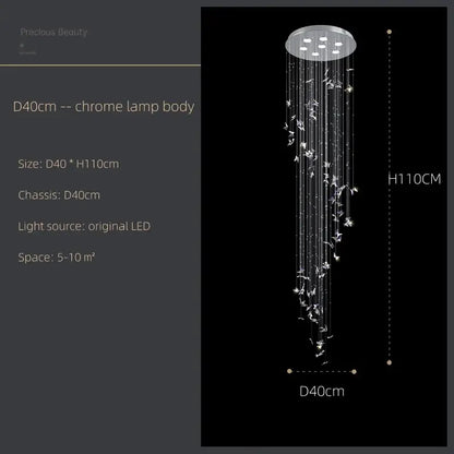 A modern chrome decorbites butterfly crystal chandelier with blue clear crystals and delicate white bird ornaments