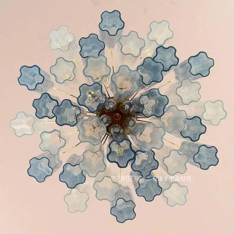 A modern blue and clear colorized glass led chandelier with scalloped glass shades for living room decorbites colorized glass