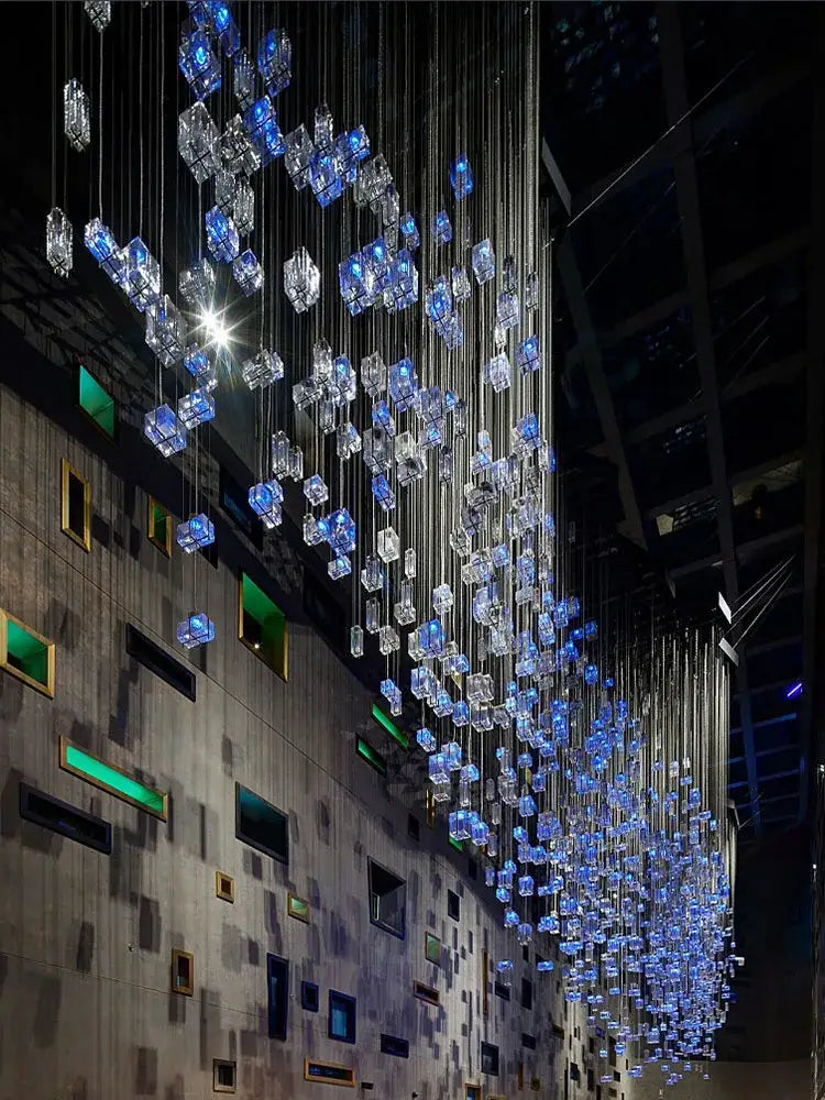 Modern blue and clear crystal cube pendant light chandelier with glowing cubes suspended by metallic wires for living room decorbites crystal cube