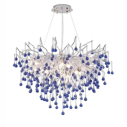 A modern blue crystal led pendant light with chrome mount and clear glass branches featuring decorbites blue crystal drops