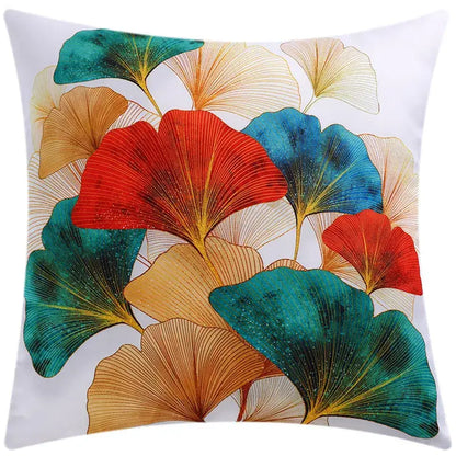Modern blue floral cushion cover featuring a vibrant multicolored ginkgo leaf pattern with teal red and gold accents